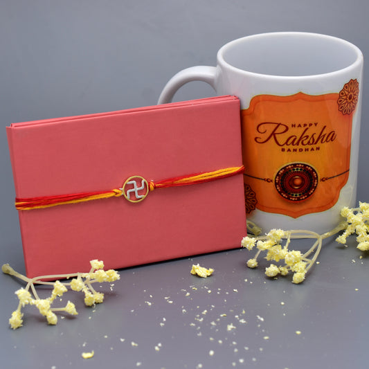 silver swastik rakhi with mug