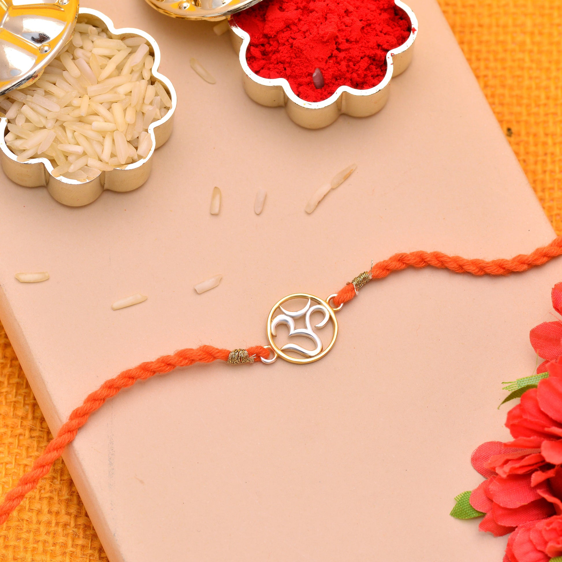 om silver rakhi