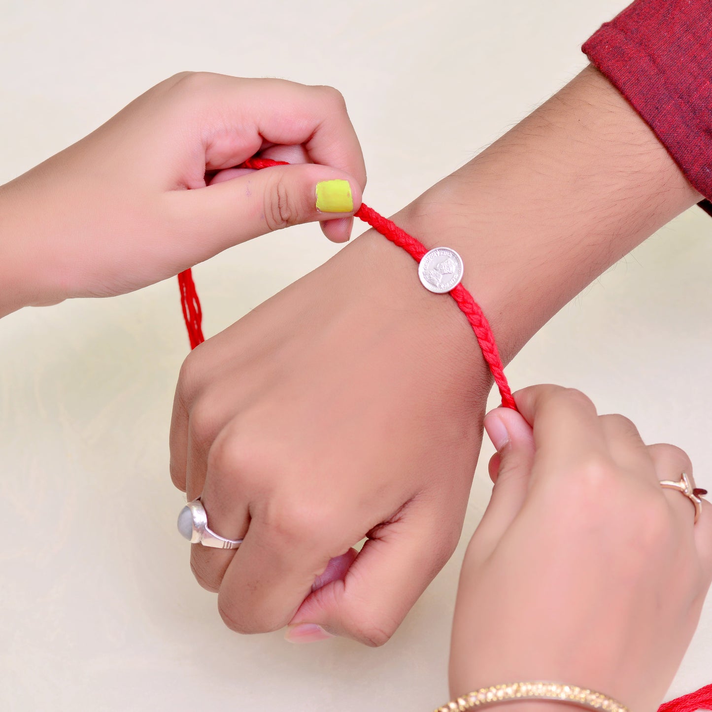 silver coin rakhi 