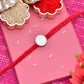 rakhi with silver coin